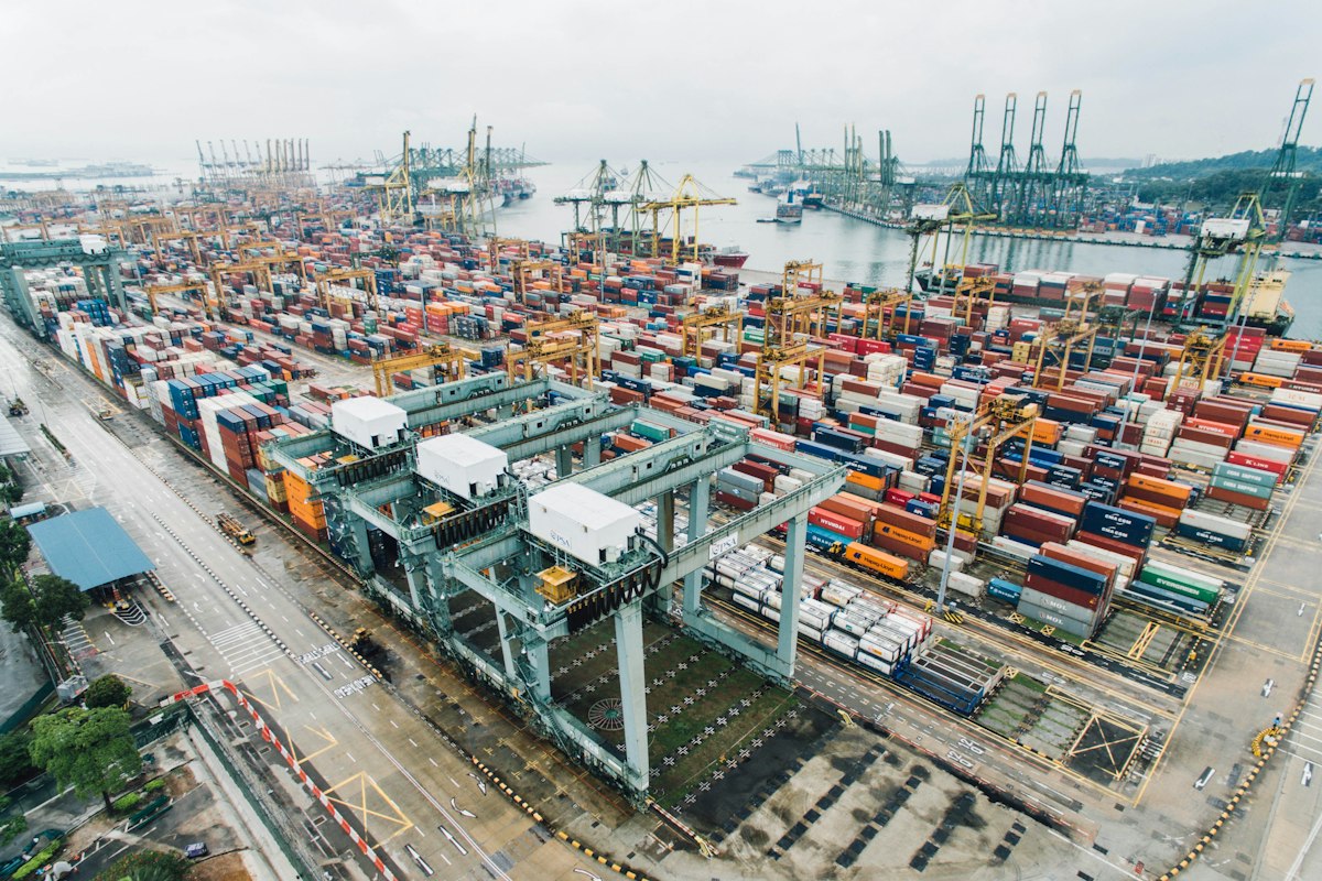 Container port with cargo ships and shipping cranes
